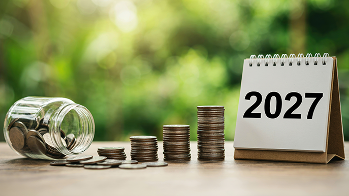 Increasing towers of coins leading to a calendar that says 2027